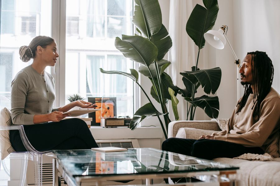 Black psychologist speaking with a Black client